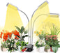 3-head LED grow light with goosenecks lighting a desk display of gerberas, hydrangeas, and small houseplants